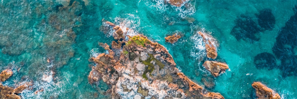 Aerial view of rocks under turquoise water 2021 08 28 05 24 52 utc