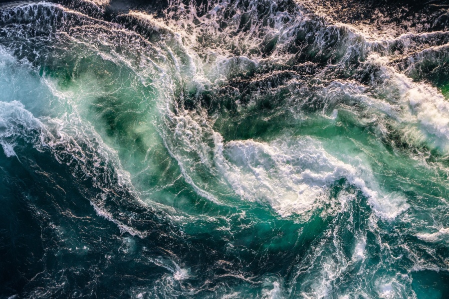 STR Blue waves of water of the river and the sea meet